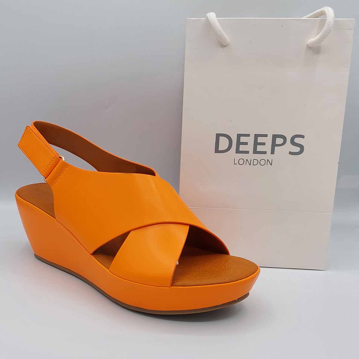 Close-up of the peep toe and wedge heel on women's sandal in Orange, highlighting their comfortable and stylish features from DeepsLondon.