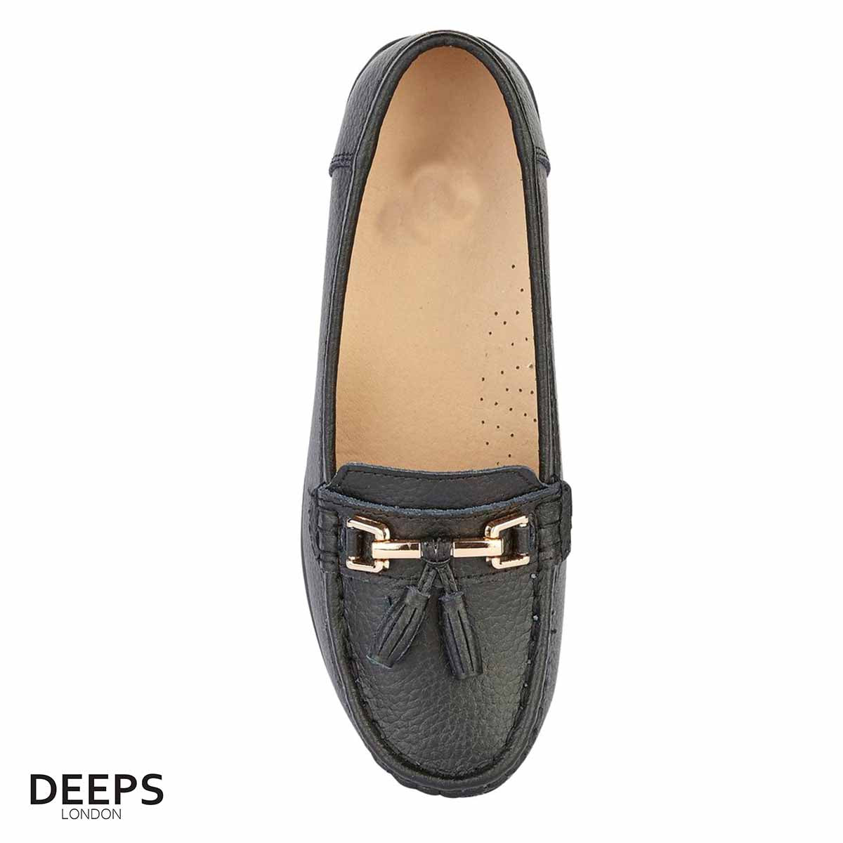 Side profile of women's leather slip-on mocassin/boat shoe in Black with tassels, showcasing its comfortable design for London wear.