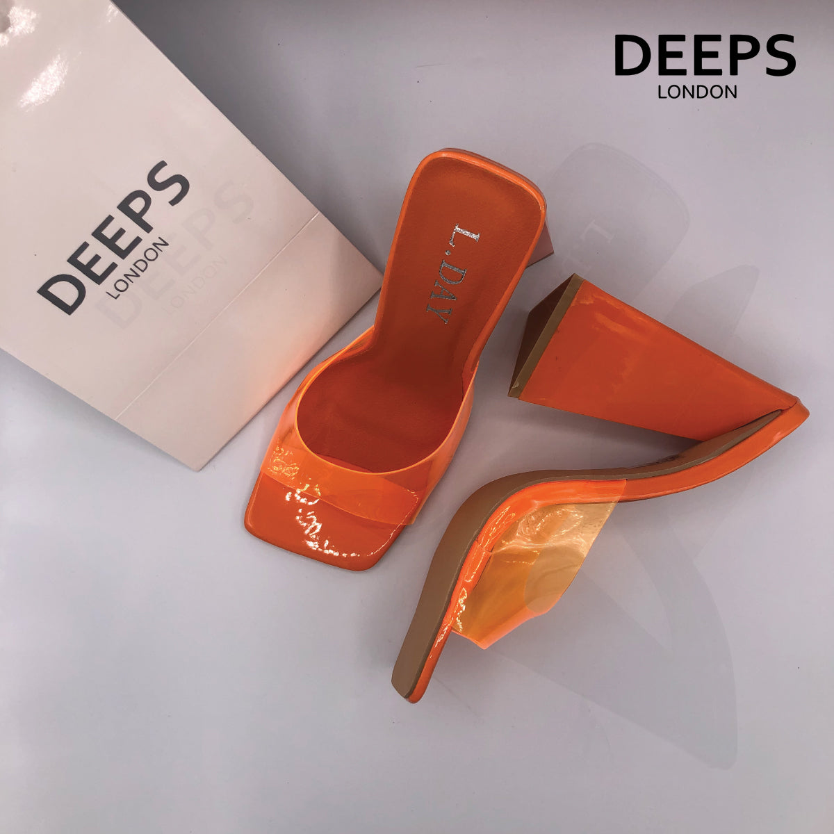 Close-up detail of Anastasia square toe high heel mule in vibrant orange, showcasing the modern square toe and sleek design, London style from DeepsLondon.