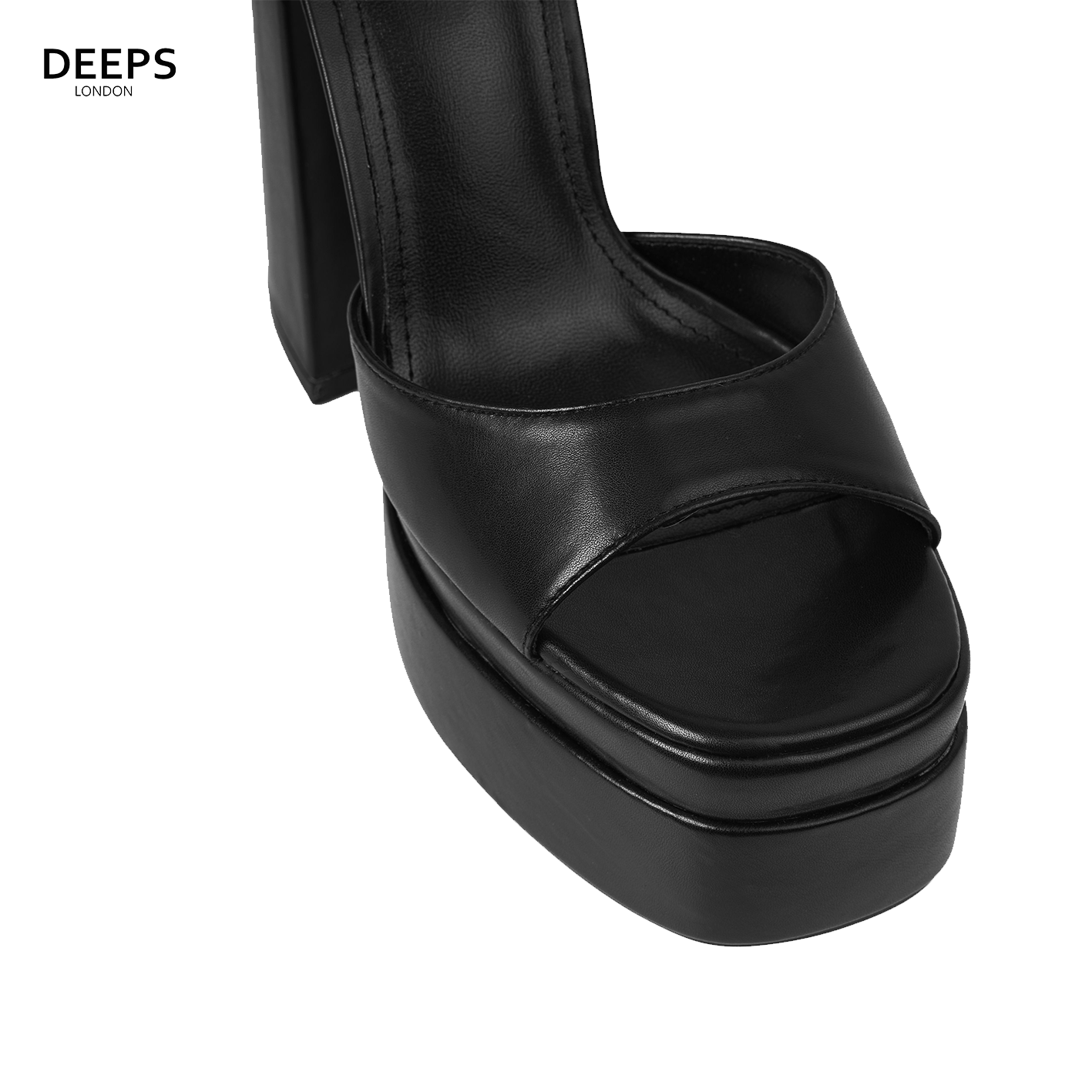 Close-up of the platform sole, ankle buckle strap, and peep/open toe on women's Apex heels in black, highlighting their bold features from DeepsLondon.