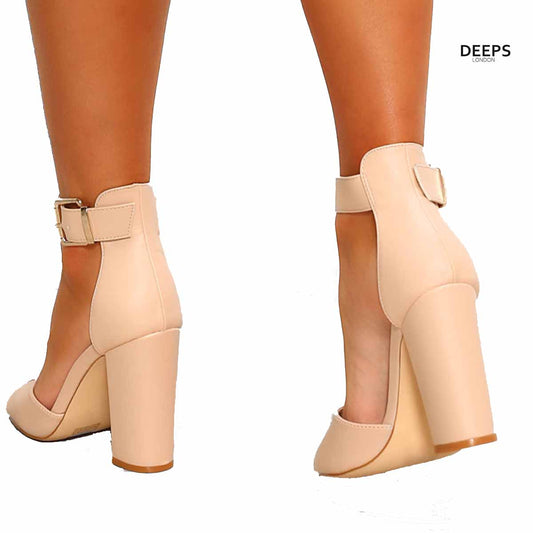 Woman's foot wearing stylish Belgravia chunky buckle strap block heel sandals (approx. 4-inch heel) in Beige back side, a fashionable and confident choice for London events from DeepsLondon.