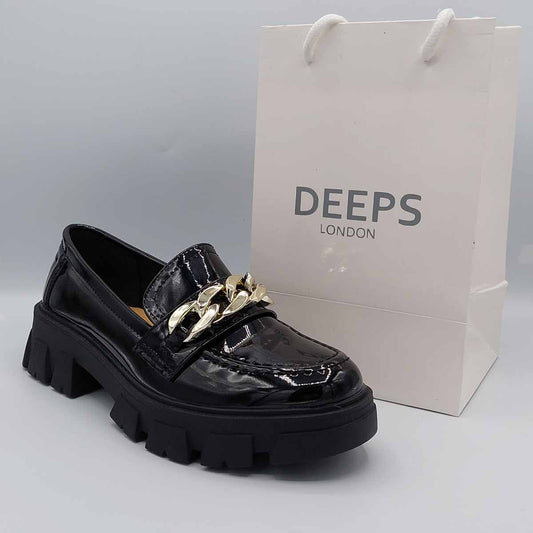 Side profile of women's black patent platform loafer featuring the chunky sole and striking chain detail, perfect for edgy London fashion.