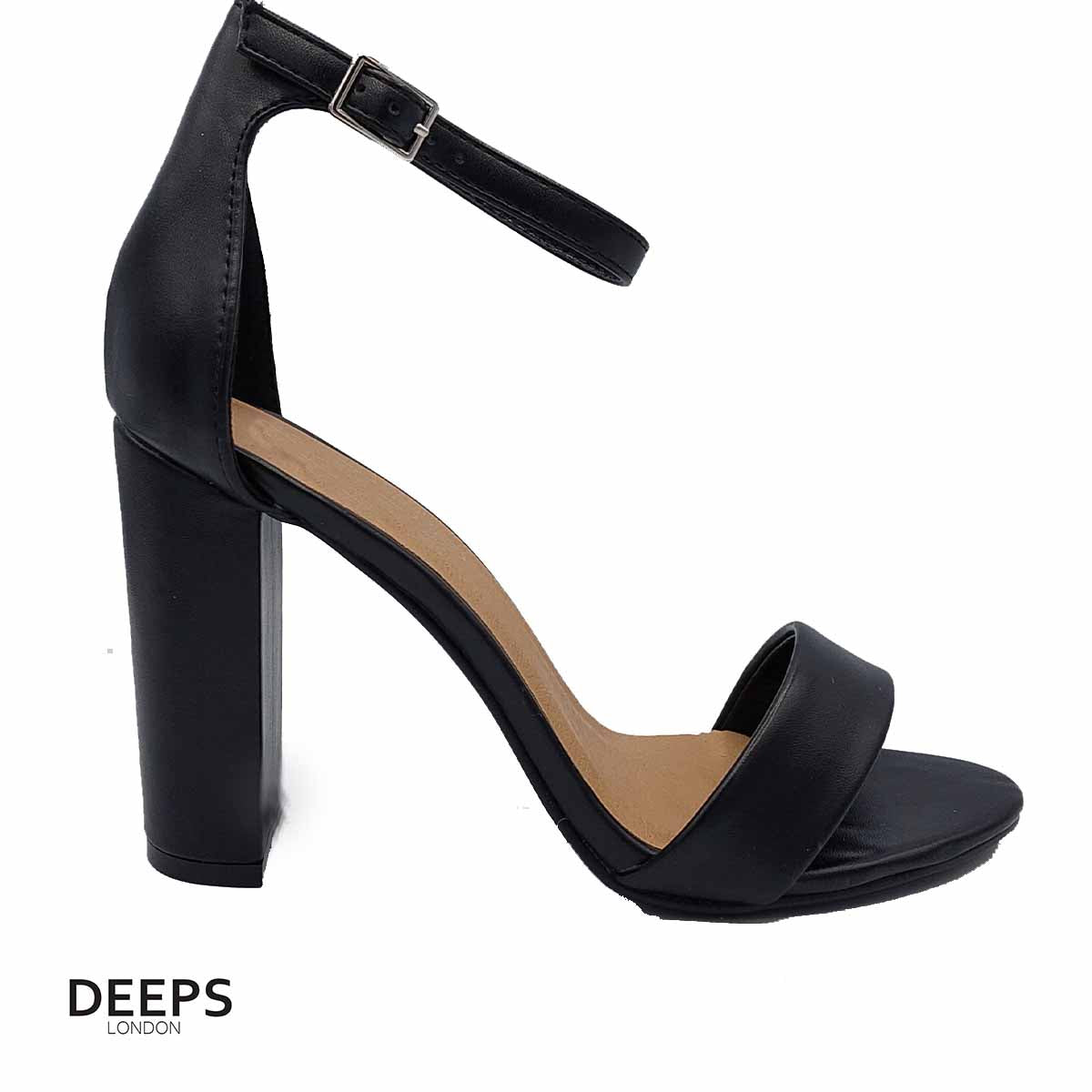 Side profile of women's chunky buckle strap block heel sandals with a 9.5cm heel in black, showcasing the block heel and chunky buckle strap detailing for London style.