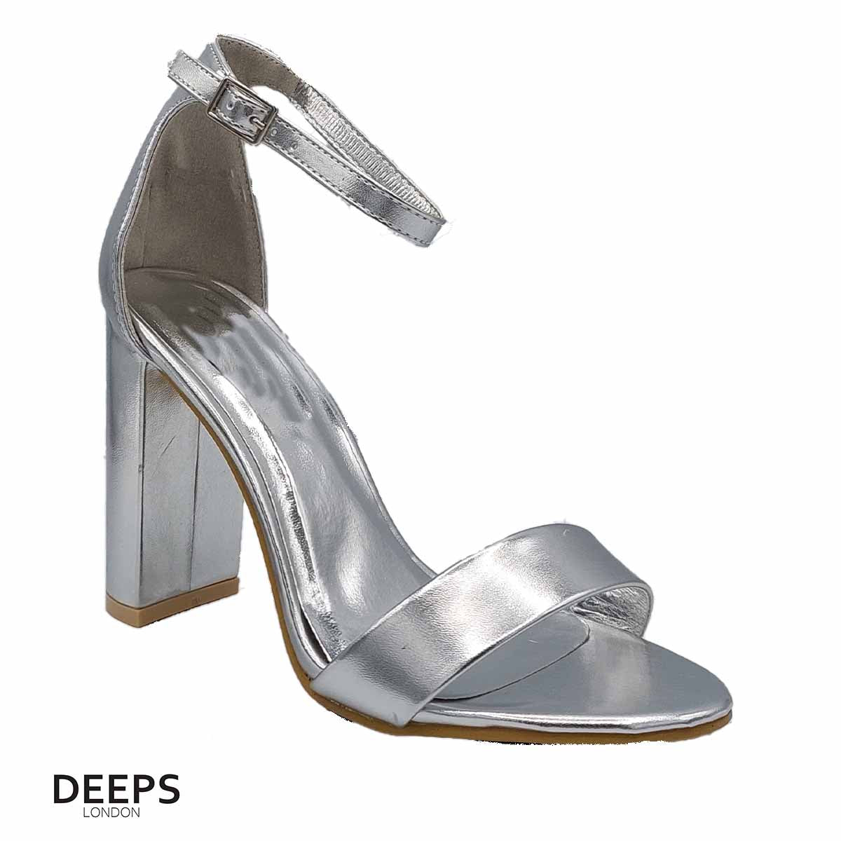 Side profile of women's chunky buckle strap block heel sandals with a 9.5cm heel in silver, showcasing the block heel and chunky buckle strap detailing for London style.
