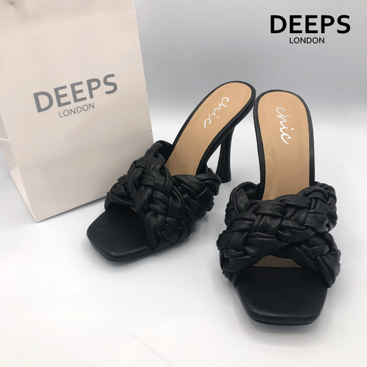 Close-up detail of women's cross braided strap high heel square toe slip-on sandal in black, showcasing the intricate braid and modern square toe, London style from DeepsLondon.