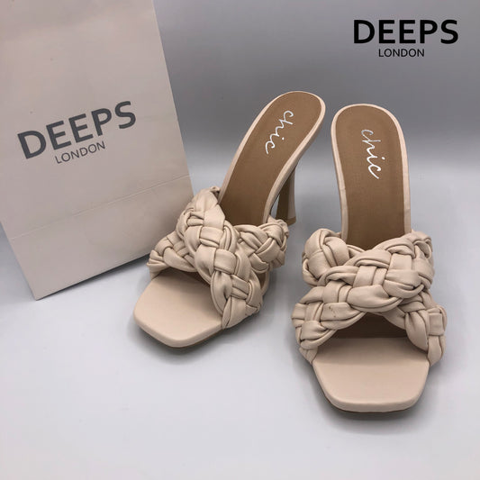 Close-up detail of women's cross braided strap high heel square toe slip-on sandal in cream, showcasing the intricate braid and modern square toe, London style from DeepsLondon.