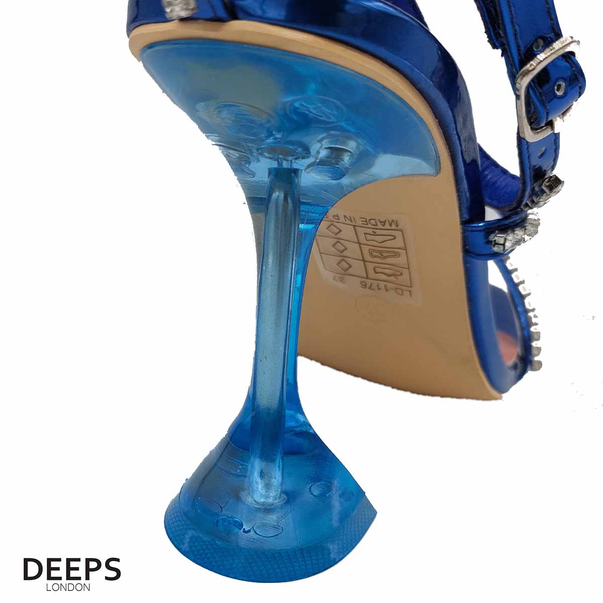 Woman's foot wearing stylish crystal embellished sandals with a pyramid heel and ankle tie in royal blue, a fashionable choice for London events from DeepsLondon.