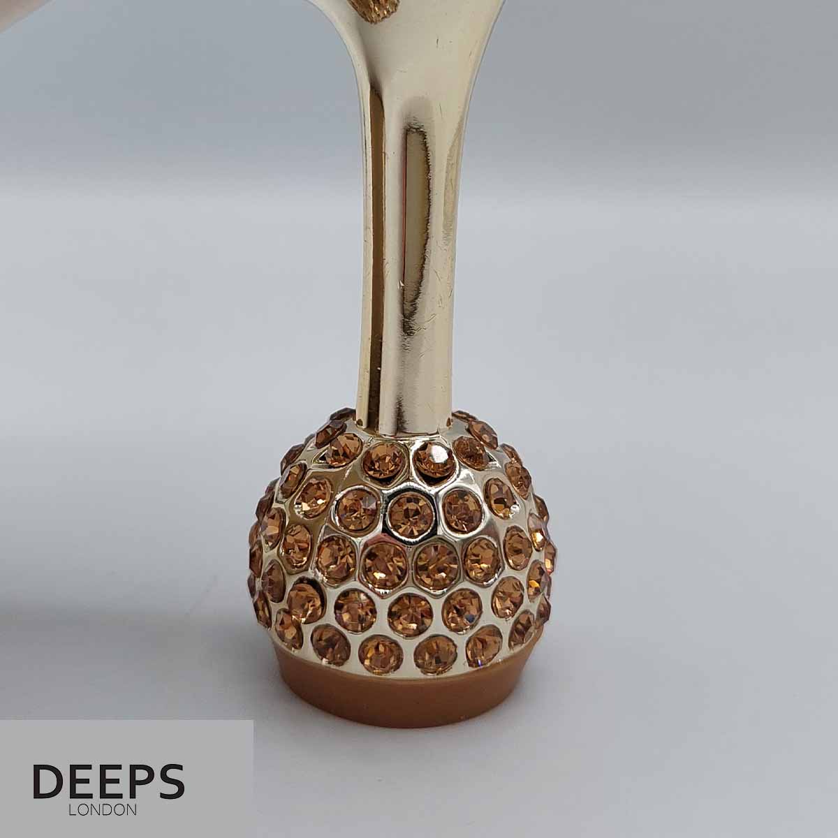 Close-up of the intricate diamante strap design and round heel on women's mule sandals in gold, highlighting their luxurious and elegant features from DeepsLondon.