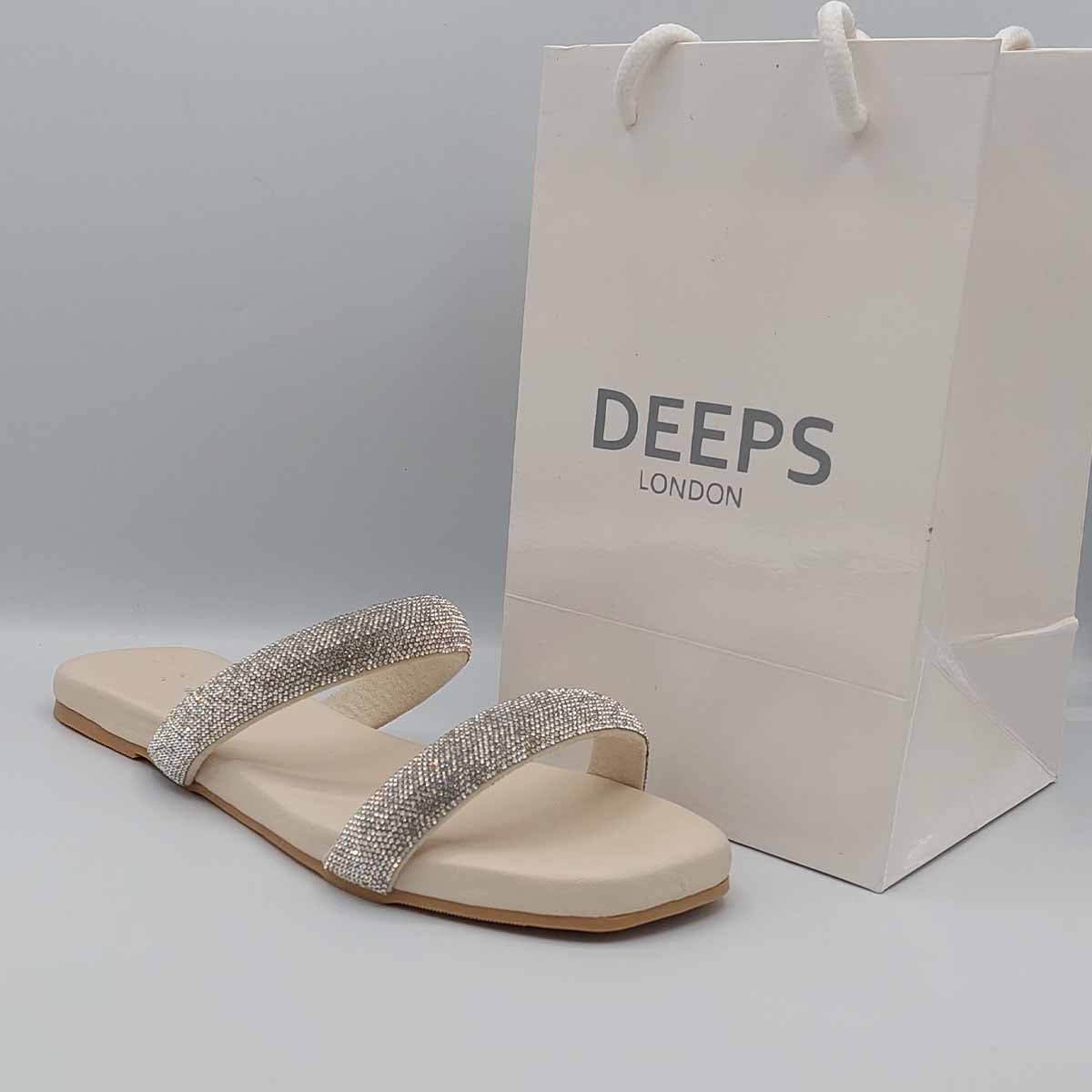 Side profile of women's double strap embellished flat slider sandals in beige, showcasing their comfortable design and sparkling detail for London style.