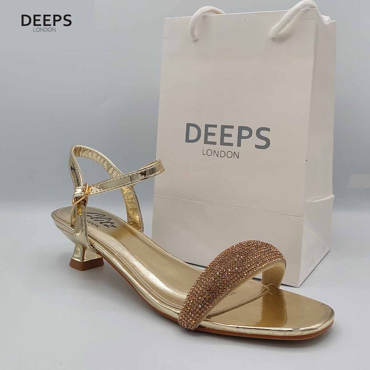 Side profile of women's Glimmer low flared heel sandals with diamante embellishments in gold, showcasing the low flared heel and sparkling straps for London fashion.