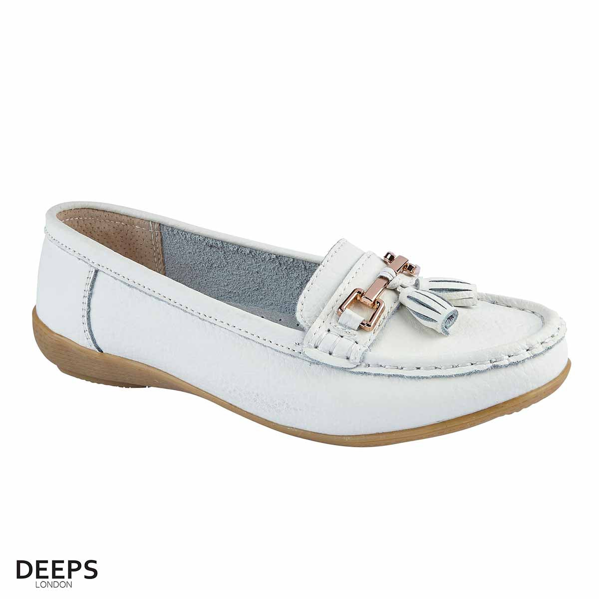 Side profile of women's leather slip-on mocassin/boat shoe in white with tassels, showcasing its comfortable design for London wear.