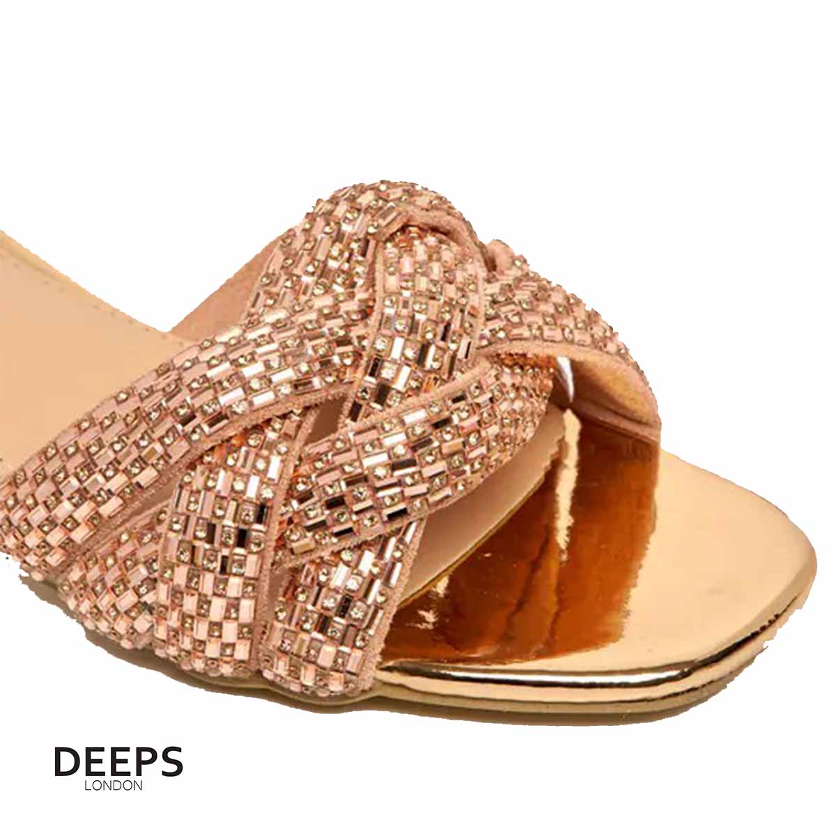 Close-up of the gemstone embellishments on Lenora plaited block heel mules in champagne, showcasing the exquisite sparkle, London style from DeepsLondon.