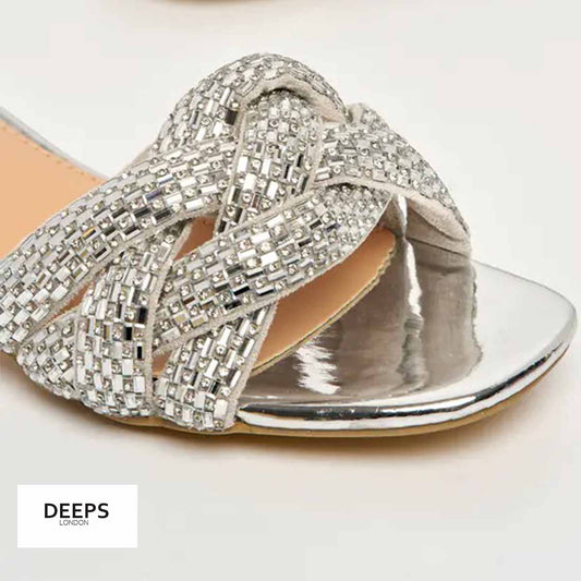 Close-up of the gemstone embellishments on Lenora plaited block heel mules in silver, showcasing the exquisite sparkle, London style from DeepsLondon.