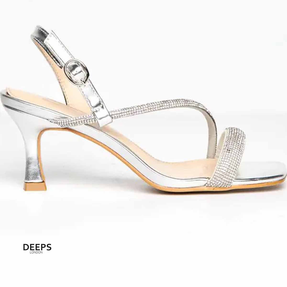 Side profile of Madi diamante embellished square toe heeled sandals in silver, highlighting the elegant heel and sparkling strap design, London style from DeepsLondon.