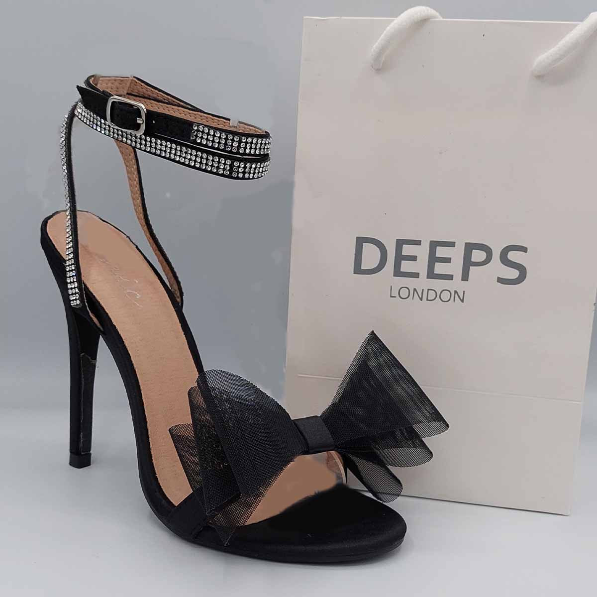 Close-up of the organza bow detail on Majesty high heel sandals in black satin, showcasing the delicate texture and embellishment, London style from DeepsLondon.