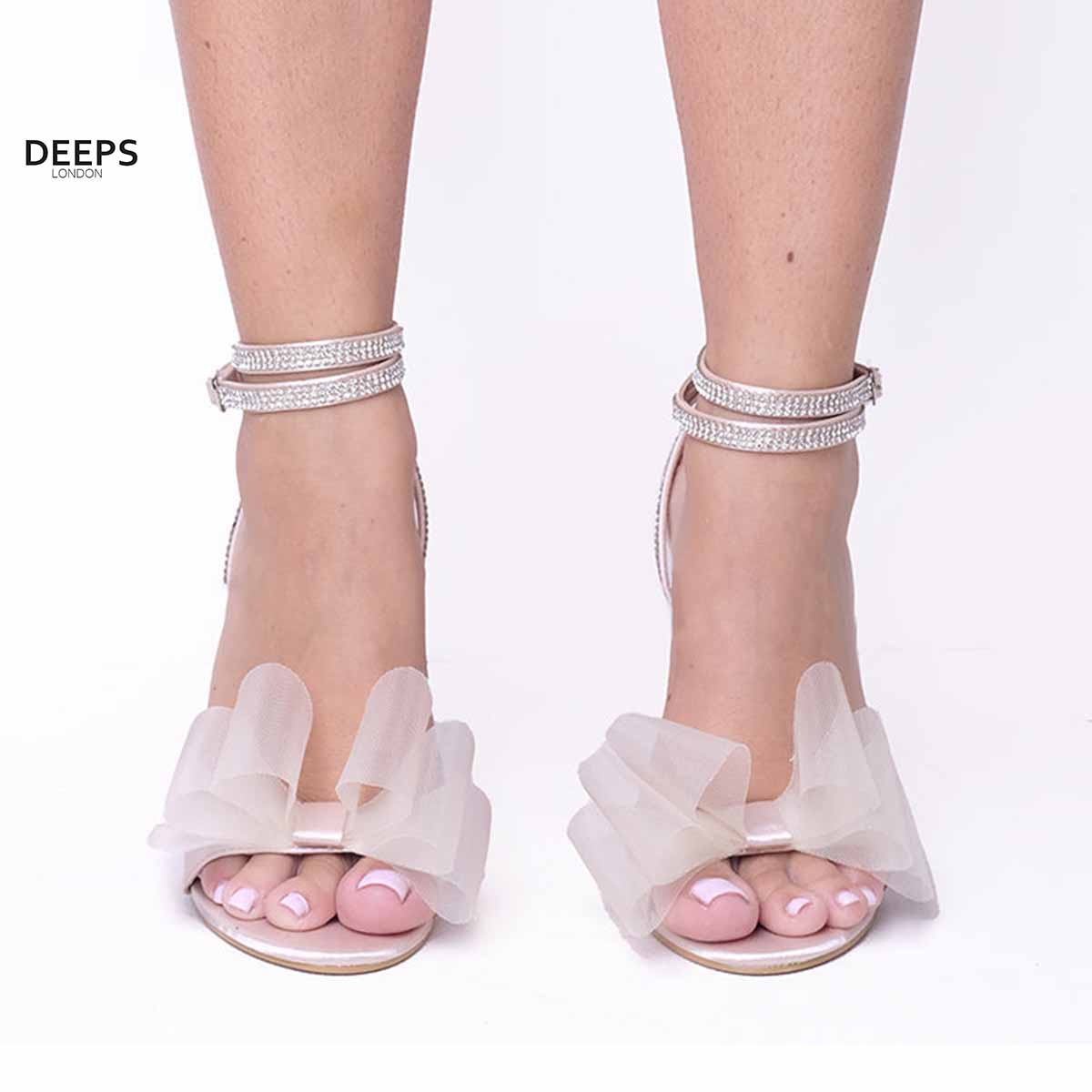 Front view of Majesty organza bow high heel sandals in champagne satin, showcasing the elegant high heel and delicate organza bow, London style from DeepsLondon.