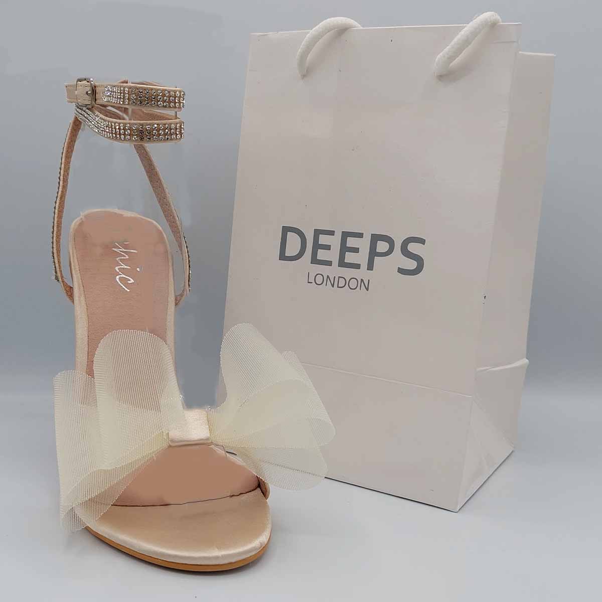 Side profile of Majesty organza bow high heel sandals in champagne satin, highlighting the stylish high heel and graceful design, London style from DeepsLondon.