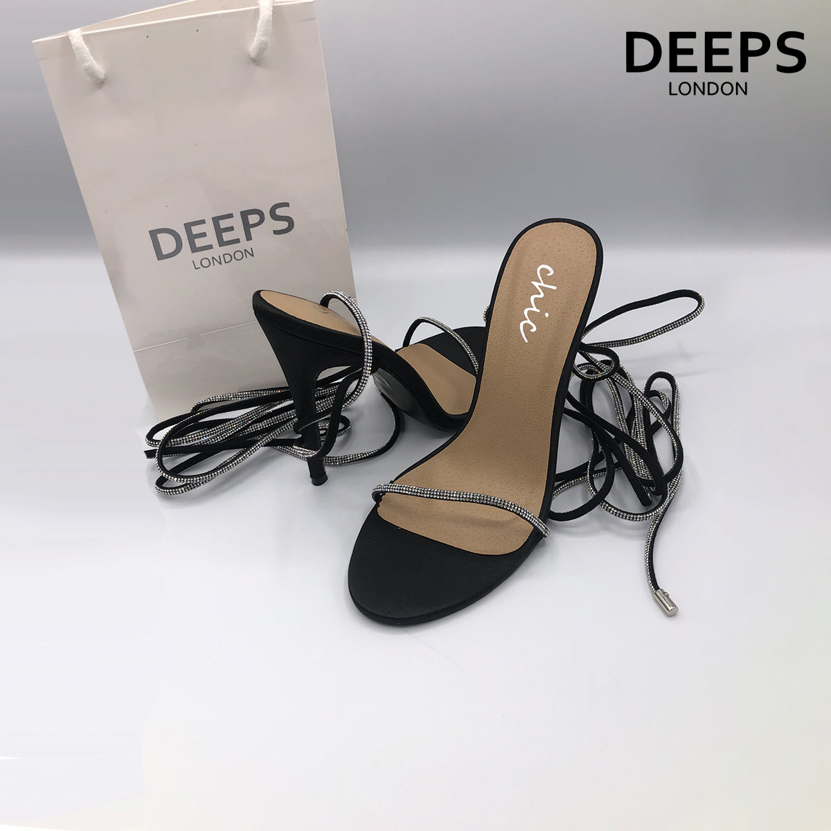 Front view of women's Nomi satin rhinestone lace-up heels in black, glamorous London party style from DeepsLondon.