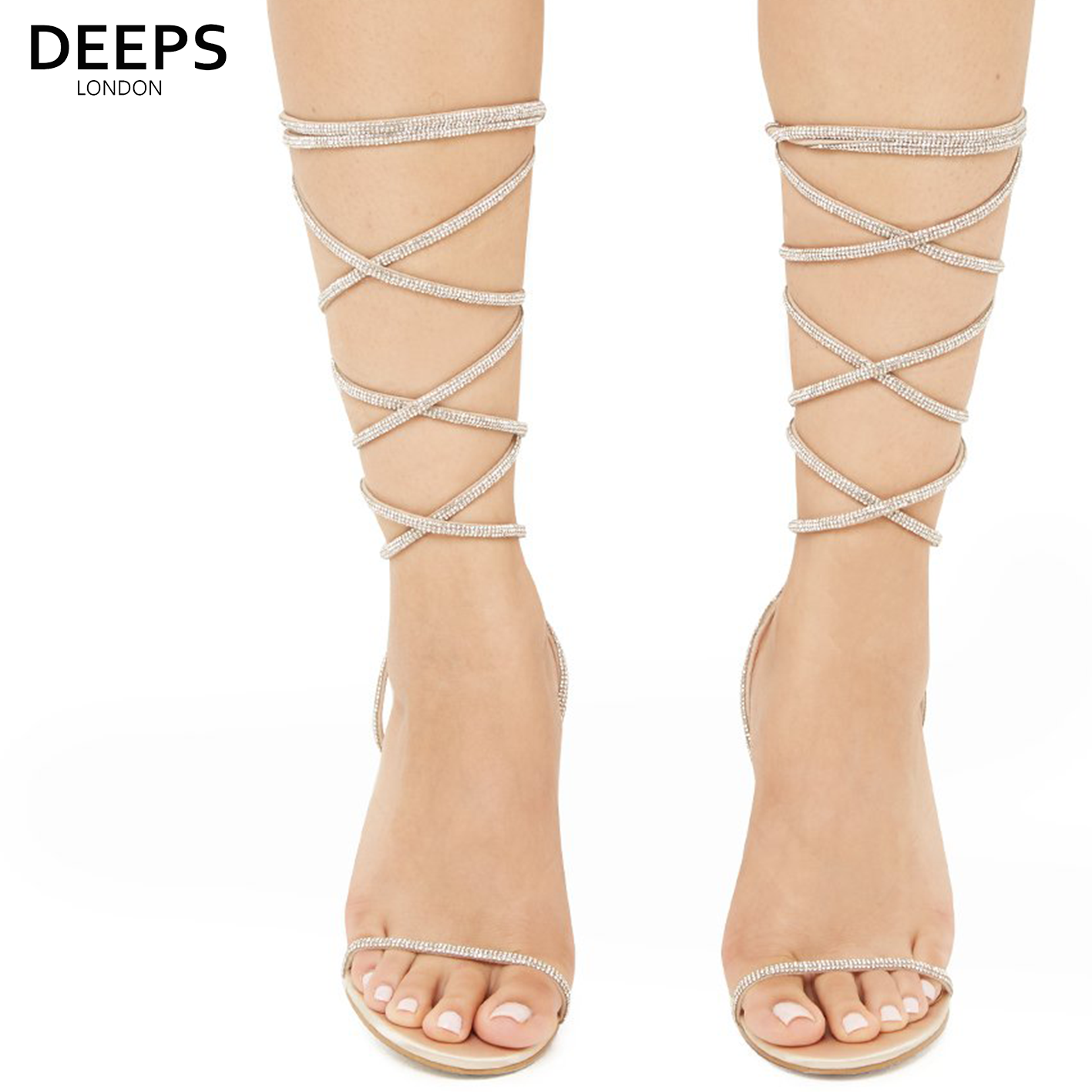 Front view of women's Nomi satin rhinestone lace-up heels in champagne, glamorous London party style from DeepsLondon.