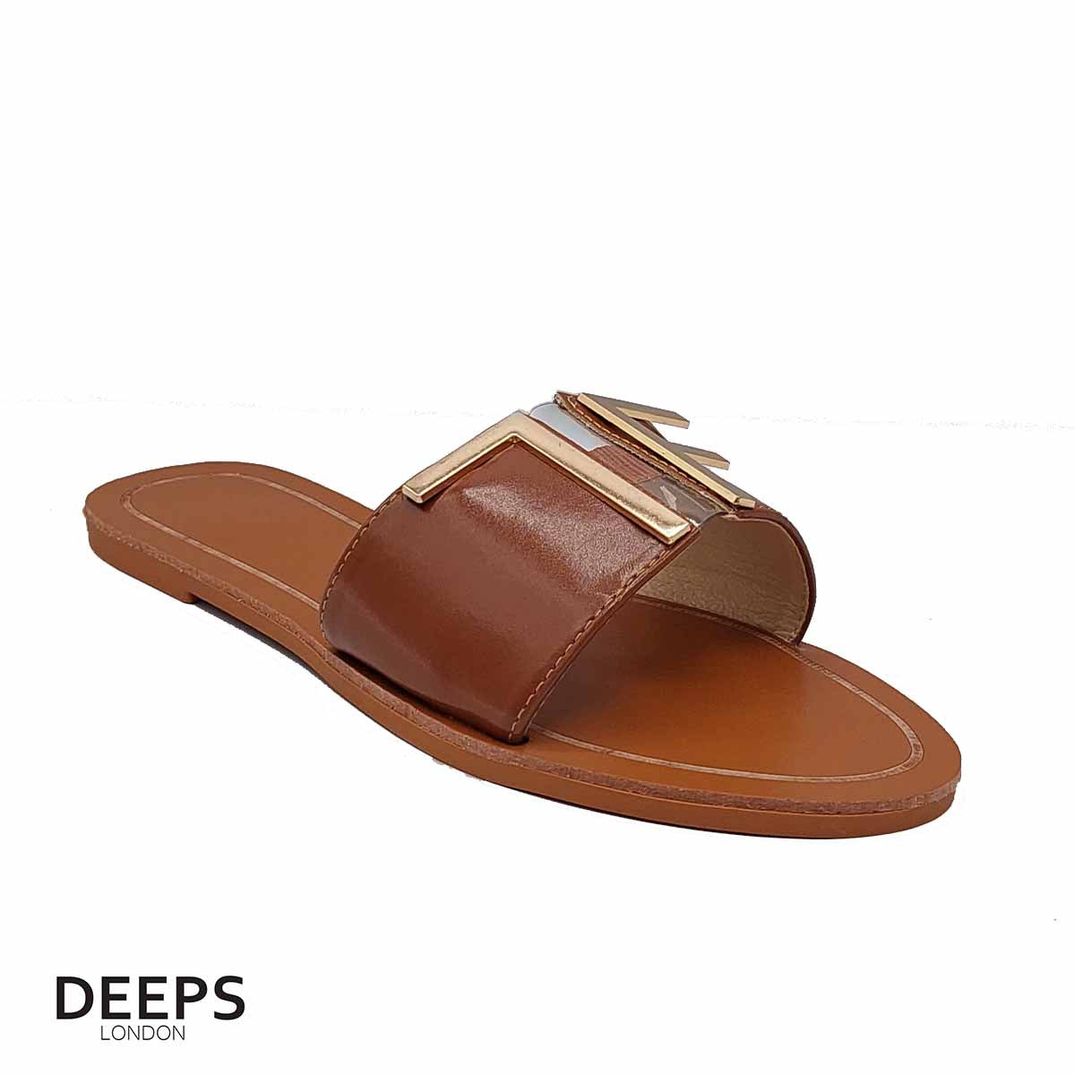 Front view of women's brown open toe flat slider sandals with a gold bar detail, a classic and versatile option for London