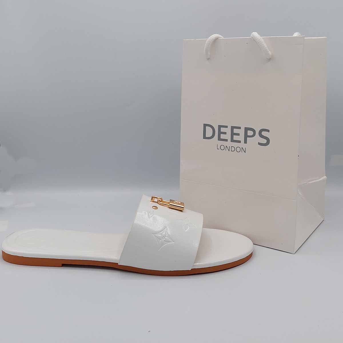 Close-up of the gold lock detail on the strap of women's open toe flat slider sandals in white, highlighting their unique and stylish feature from DeepsLondon.