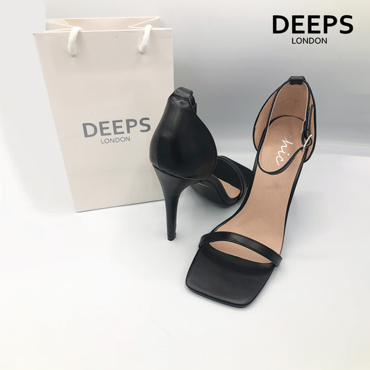 Front view of women's Radius square toe high heels with buckle ankle strap in black, sharp London style from DeepsLondon.