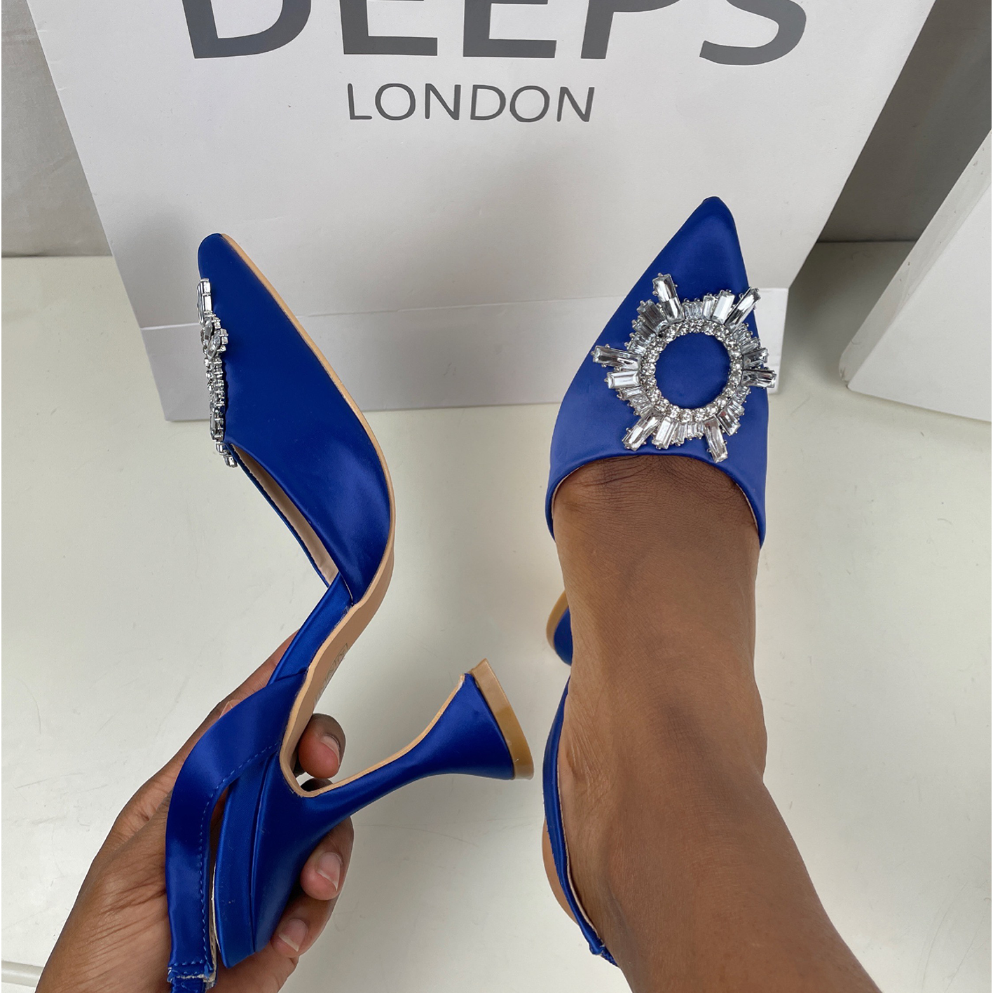 Close-up of the diamante detail on women's satin court shoes in Navy, highlighting their elegant features from DeepsLondon.