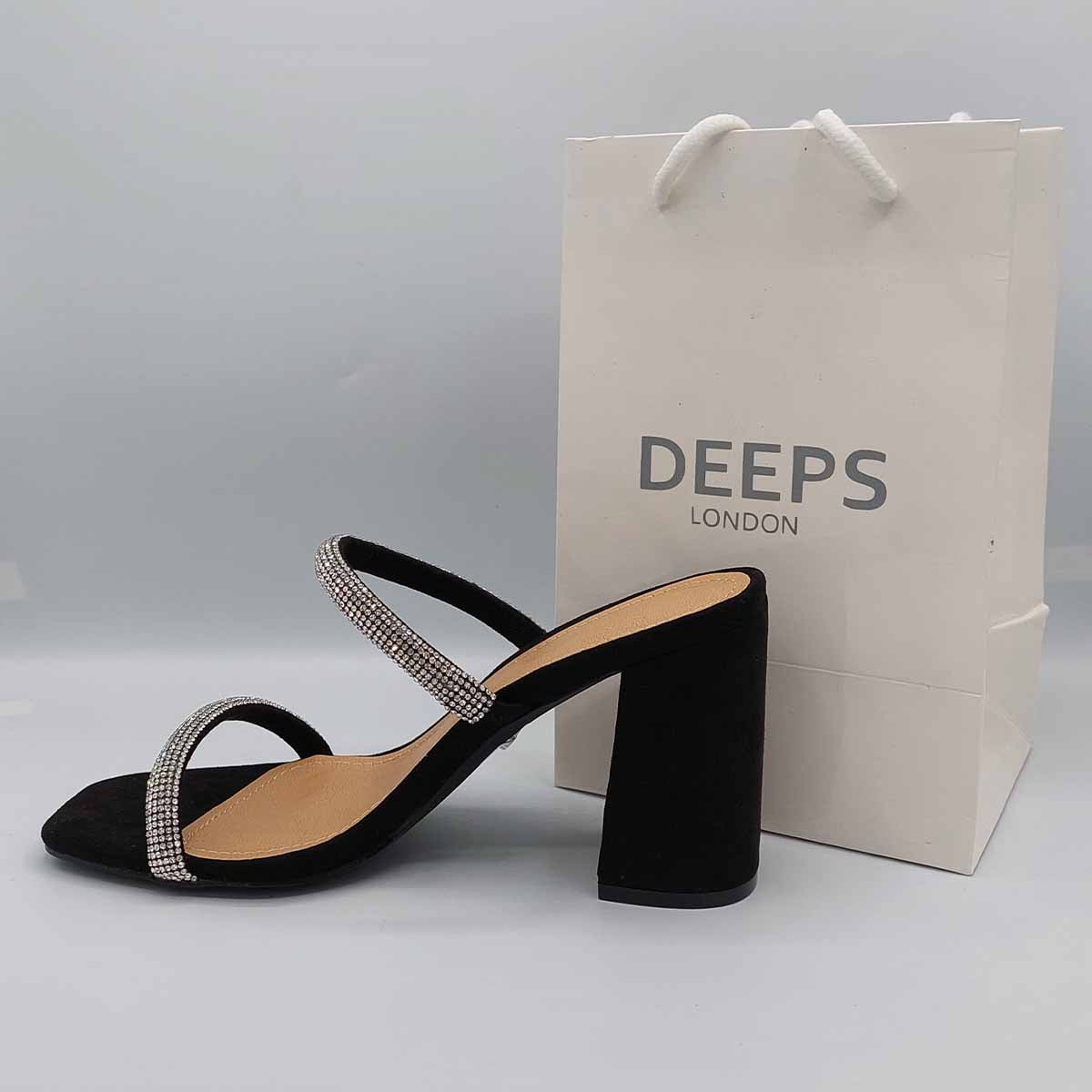 Close-up of the diamante detailing on the two straps and the chunky heel of women's Starlight mules in black, highlighting their elegant features for London style.