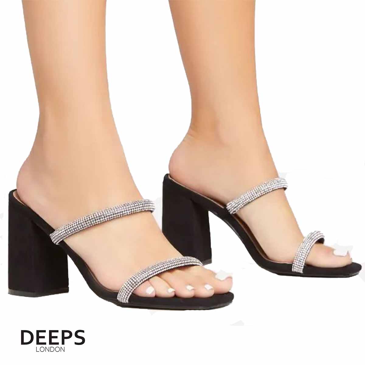 Woman's foot wearing stylish Starlight diamante chunky heel mules in black, a comfortable and fashionable choice for London days or evenings from DeepsLondon.
