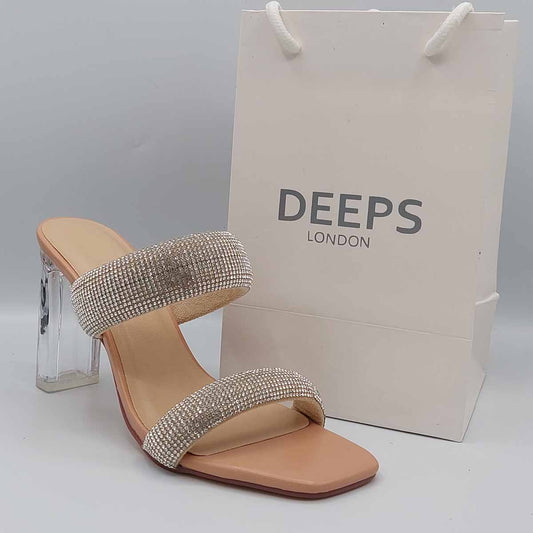 Front view of women's two-strap diamante clear perspex block heel mules in beige, modern occasion sandals for London from DeepsLondon.