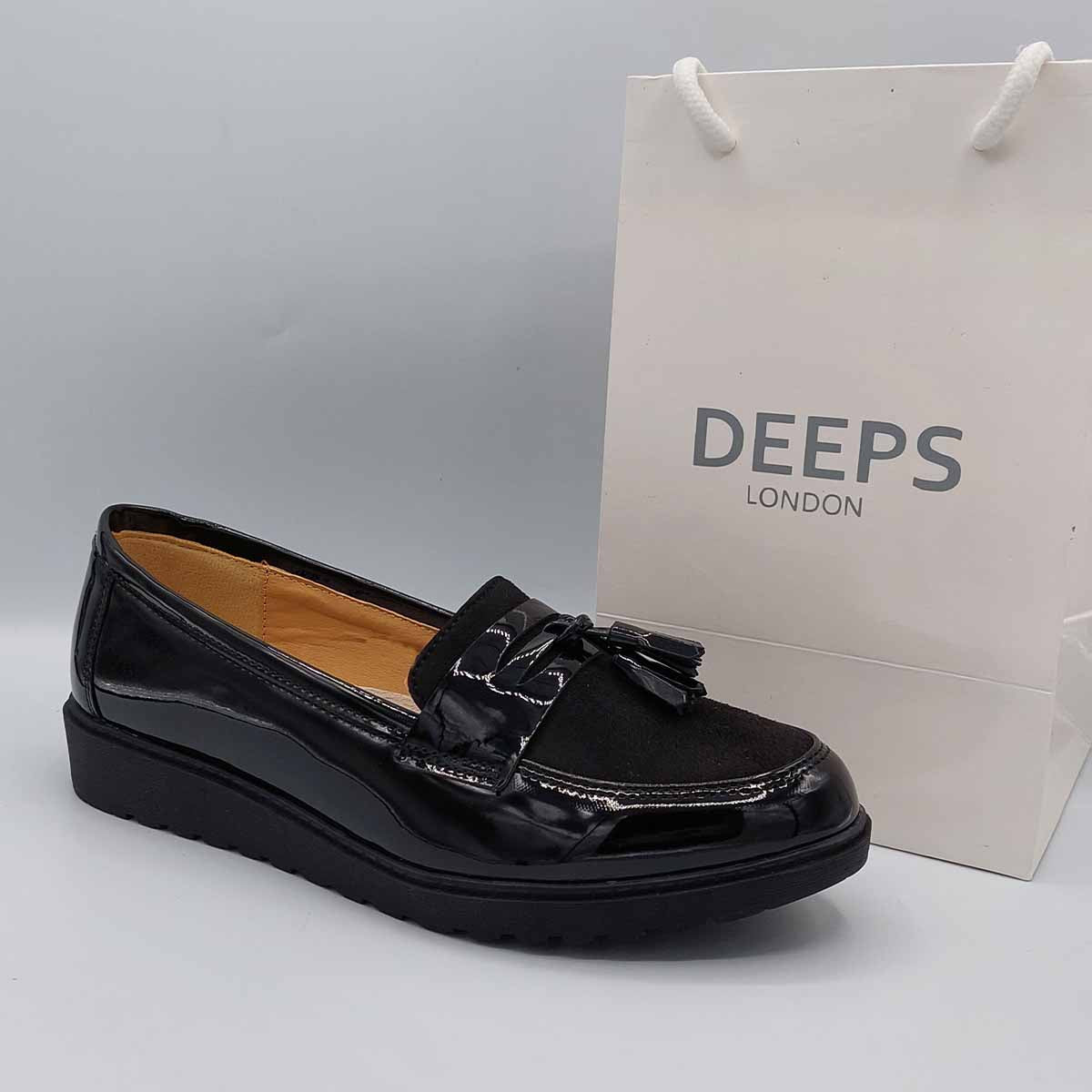 Side profile of wide fit black patent chunky tassel loafers for women, highlighting the chunky sole and tassel detail, ideal for all-day comfort in London.