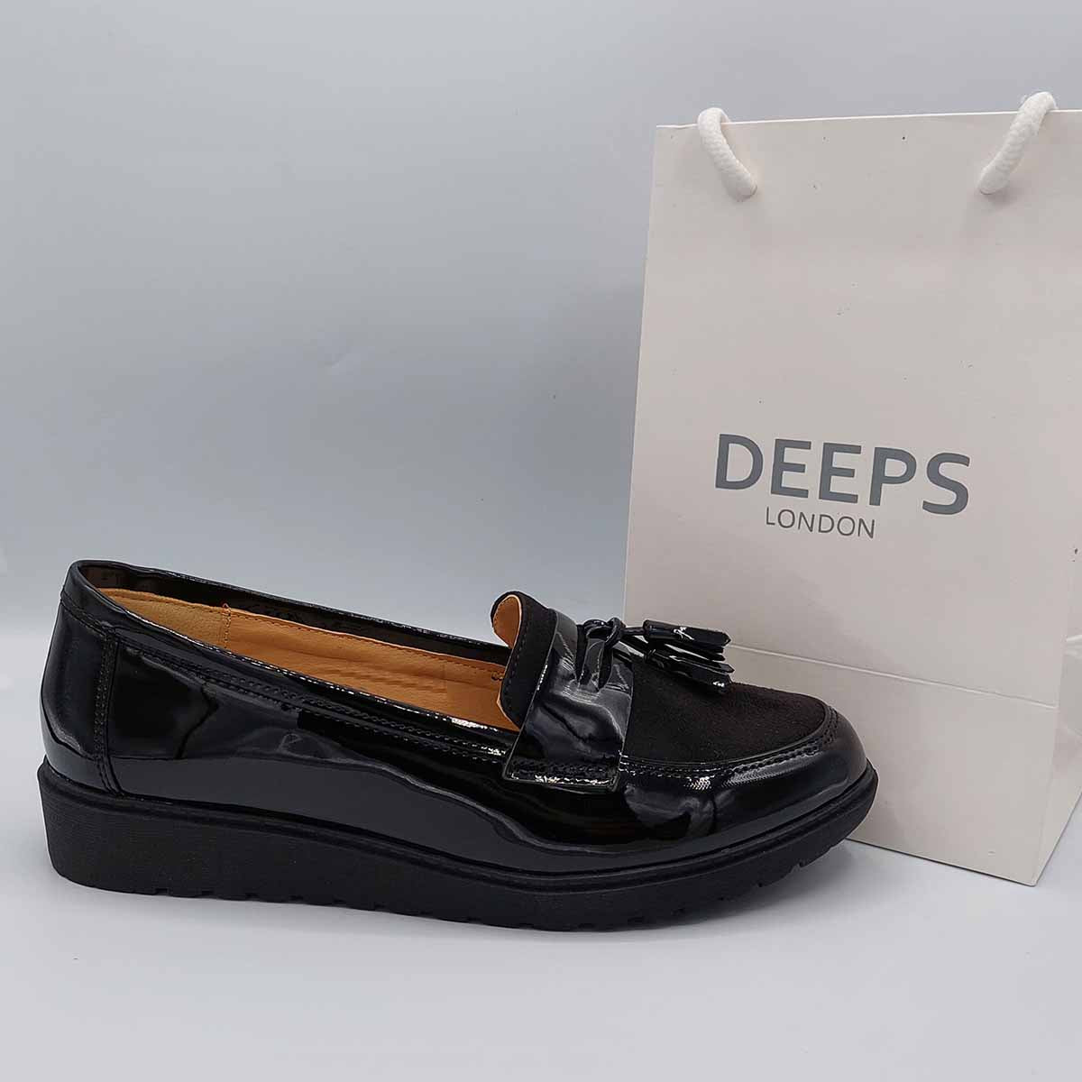 side view of women's wide fit black patent chunky tassel loafers, offering comfortable style in London.