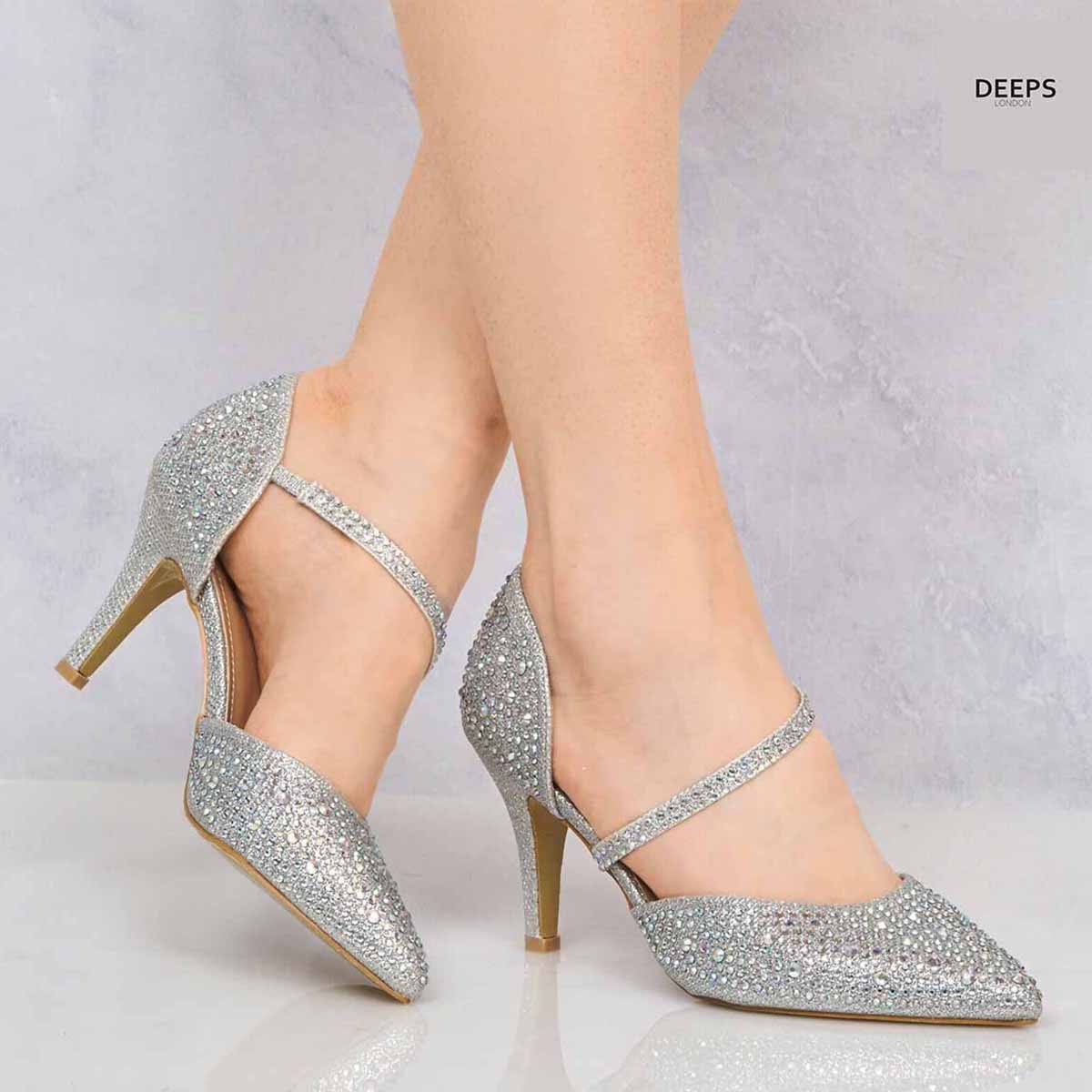 Close-up of the diamante ankle strap on Winne kitten heel courts in Silver Diamond, showcasing the exquisite sparkle, London style from DeepsLondon.