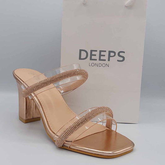 Front view of Yuna clear diamante chunky heel mules in champagne, showcasing the bold chunky heel and sparkling diamante details, London style from DeepsLondon.