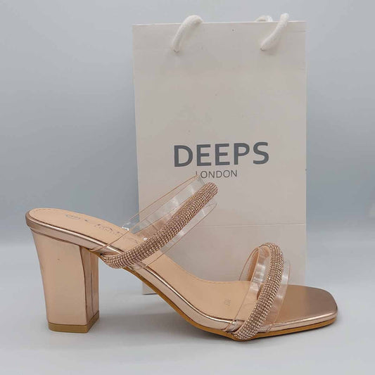 Side profile of Yuna clear diamante chunky heel mules in champagne, highlighting the stylish chunky heel and clear strap design, London style from DeepsLondon.