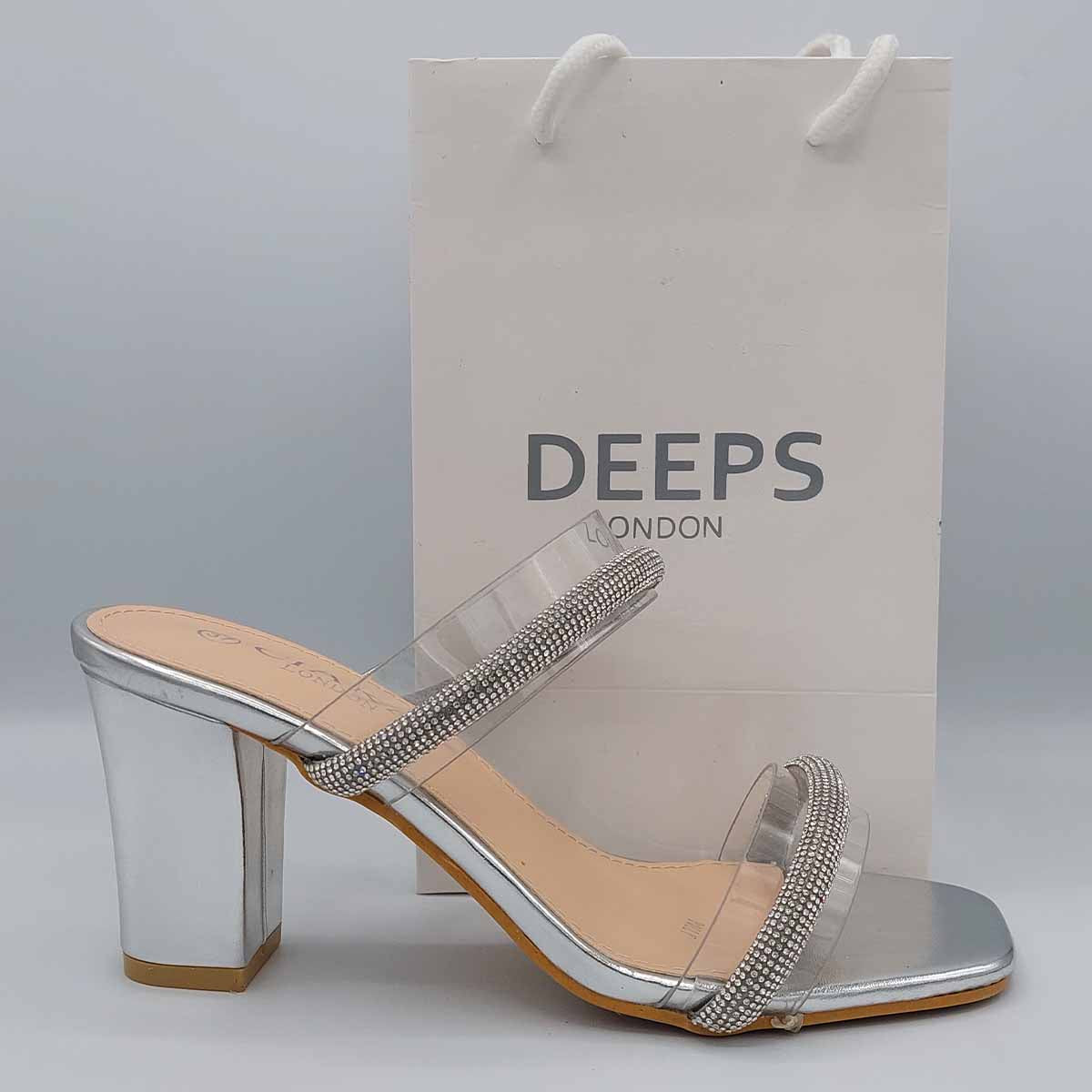 Side profile of Yuna clear diamante chunky heel mules in silver, highlighting the stylish chunky heel and clear strap design, London style from DeepsLondon.