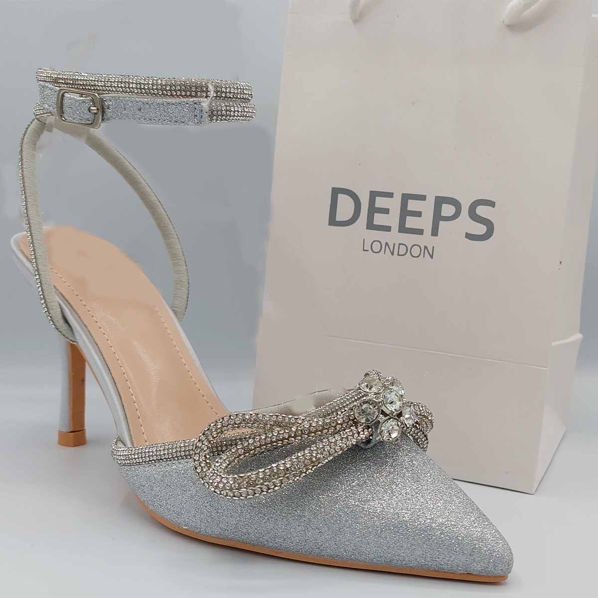 Front view of Zala double bow court heels in silver fine glitter, showcasing the elegant silhouette and double bow detail, London style from DeepsLondon.