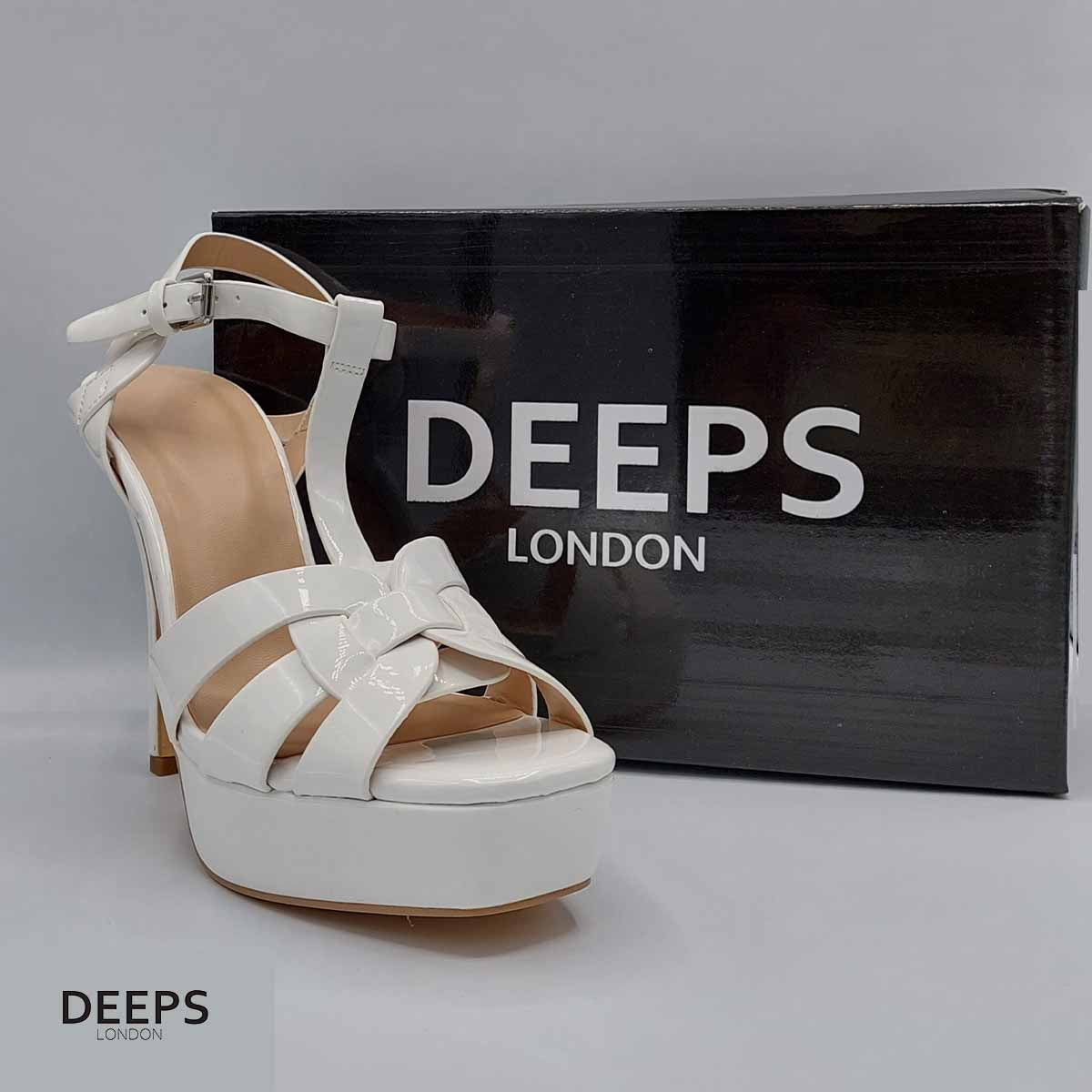 Front view of women's Zenith platform T-bar stiletto sandals with 11cm heel in white patent, statement London style from DeepsLondon.